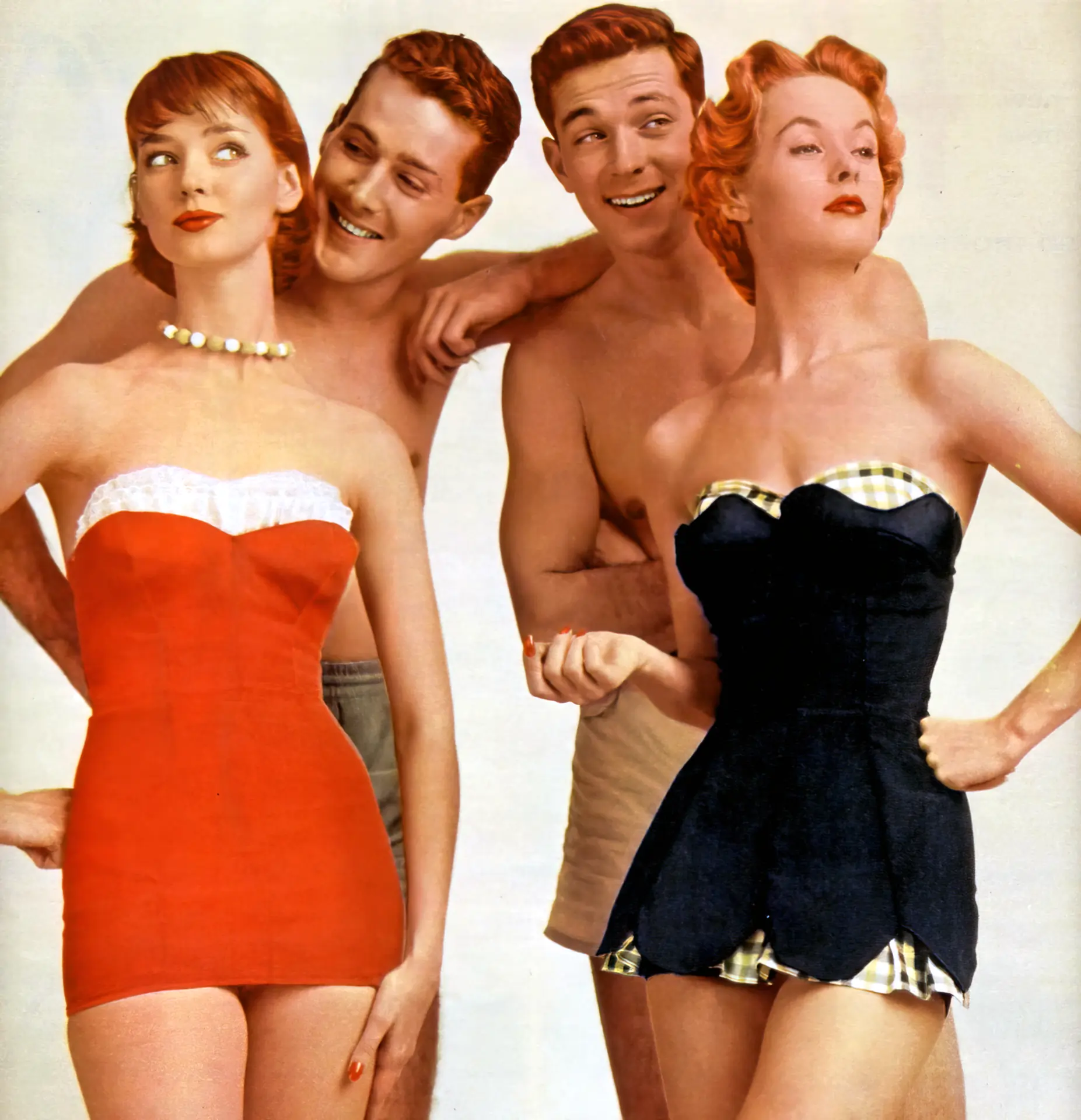 Two amazing retro girls with two guys standing behind them