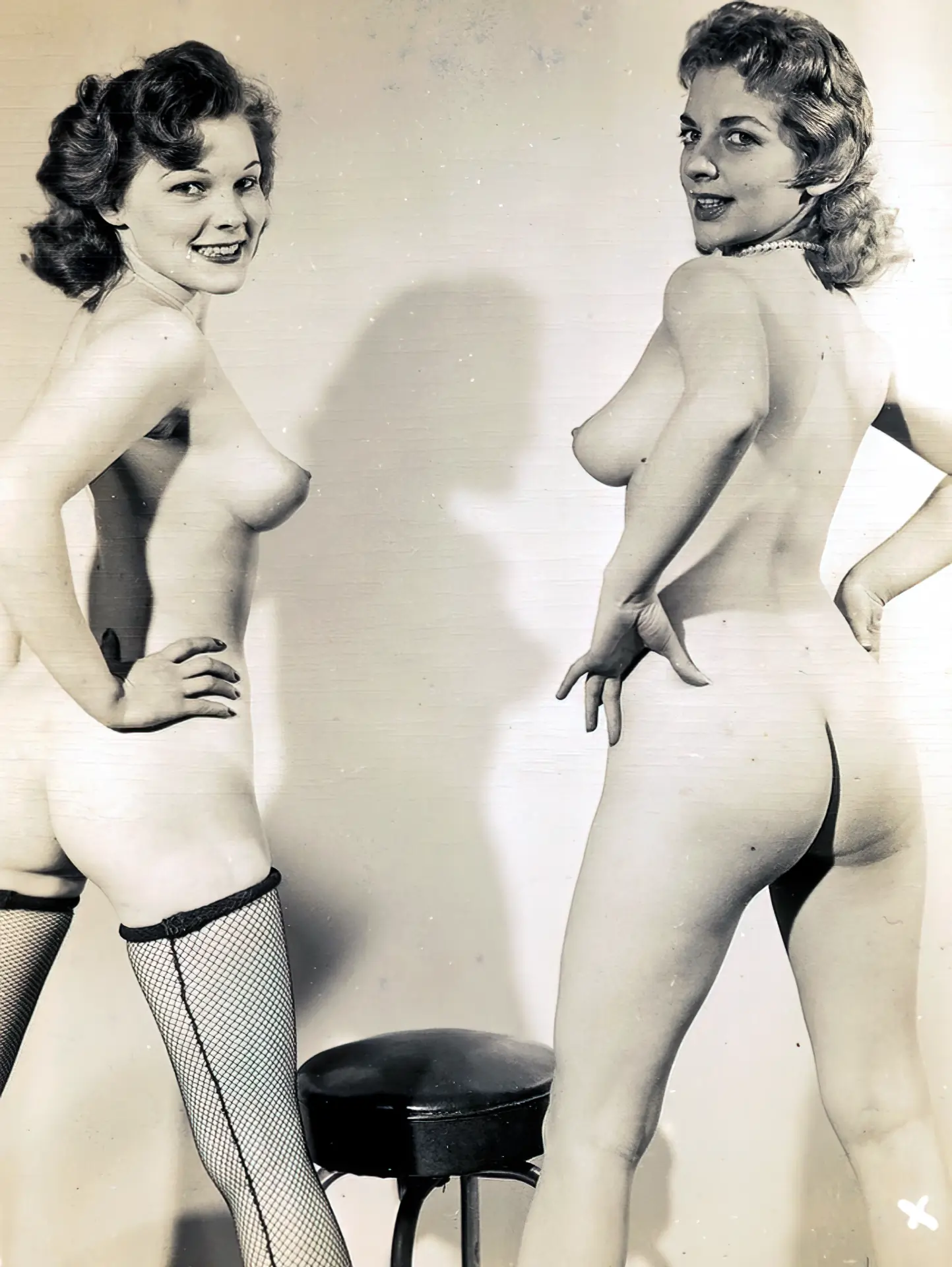 Two glamorous looking vintage chicks show off their bare asses