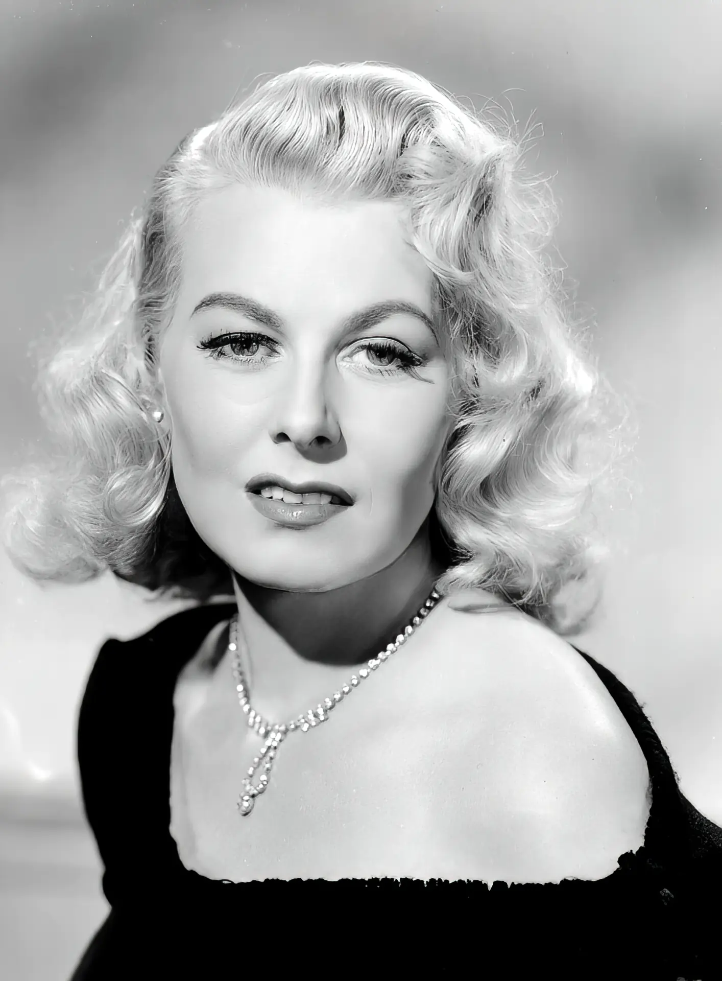 Beautiful vintage blonde actress poses for a photo portrait