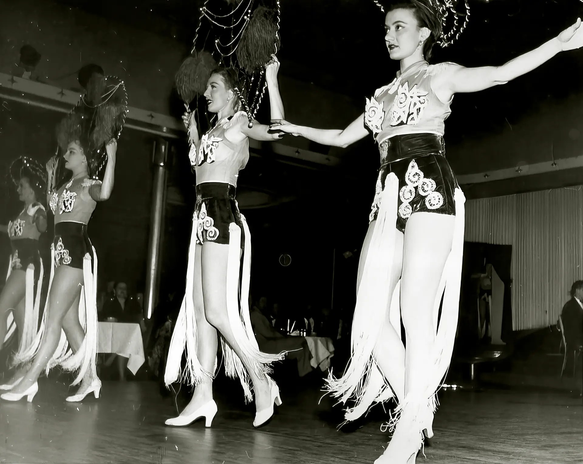 Beautiful vintage girls dance in a burlesque theatre