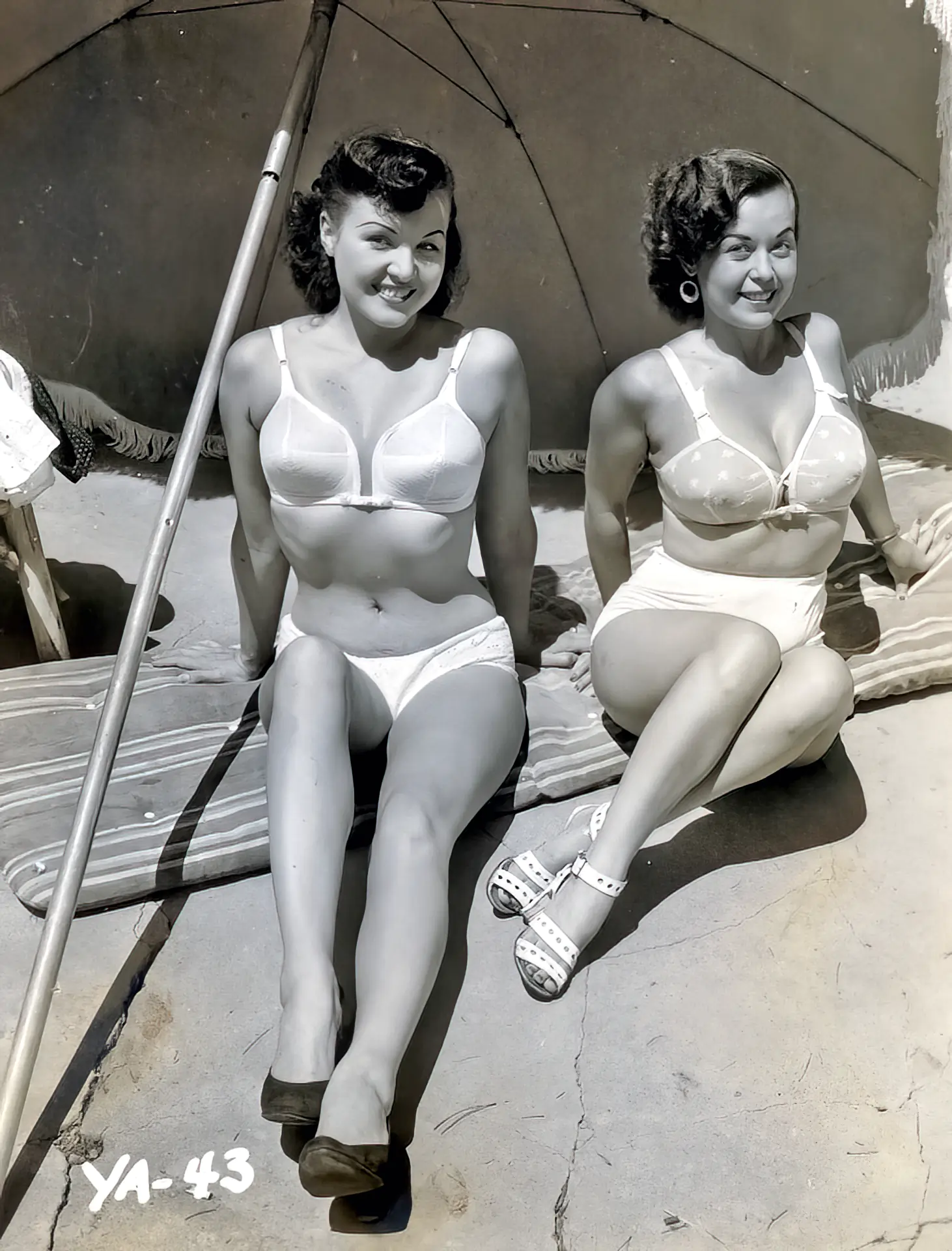 Seductive babes pose in their vintage bikinis on the beach