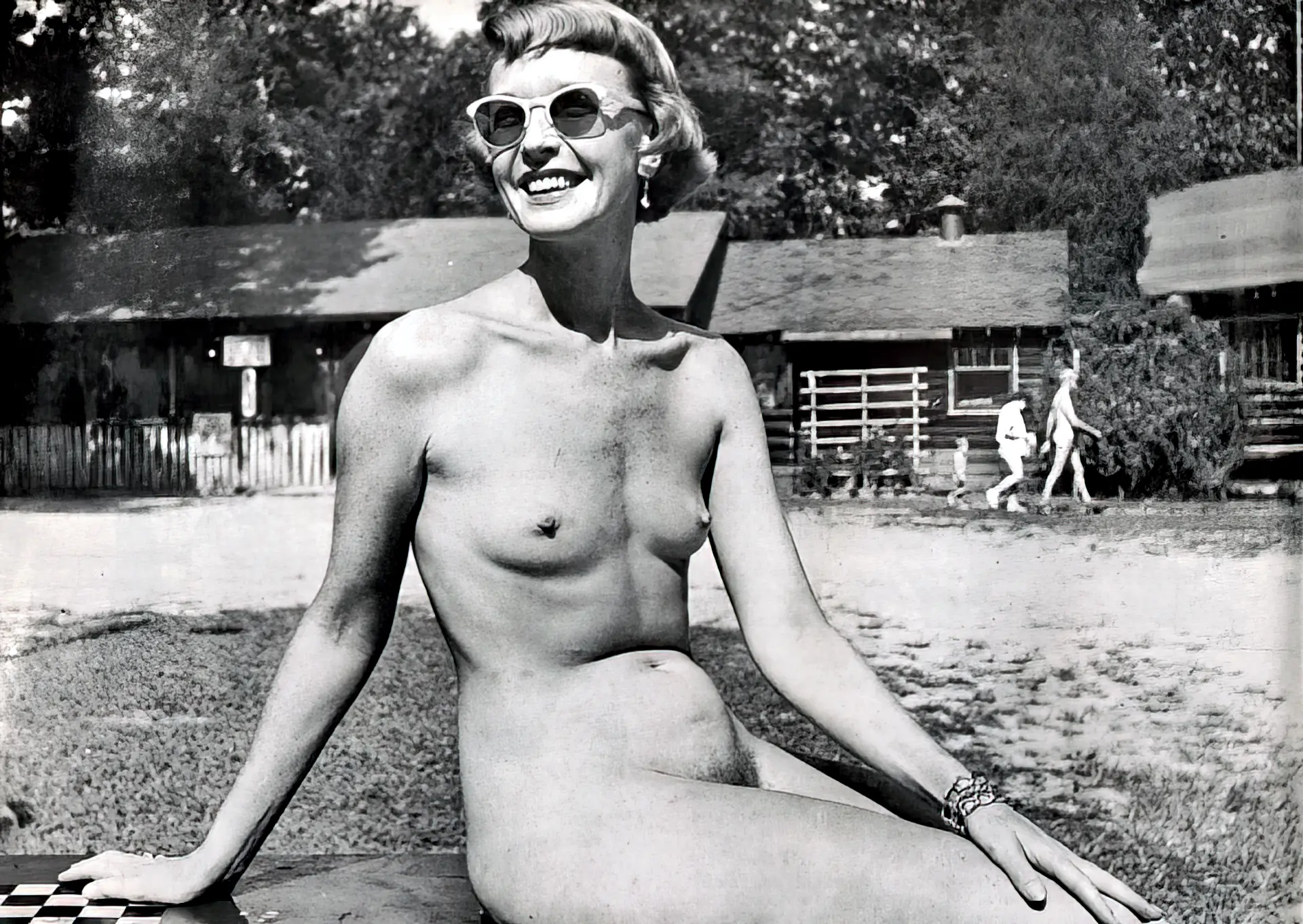Skinny vintage honey with small tits poses in her sunglasses