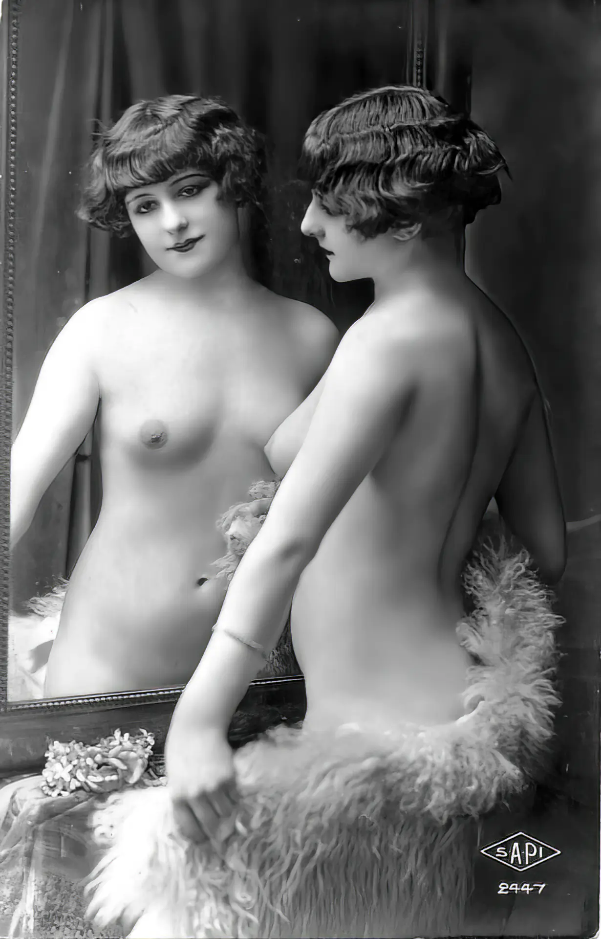 Hot young antique lady poses by the mirror with her small tits