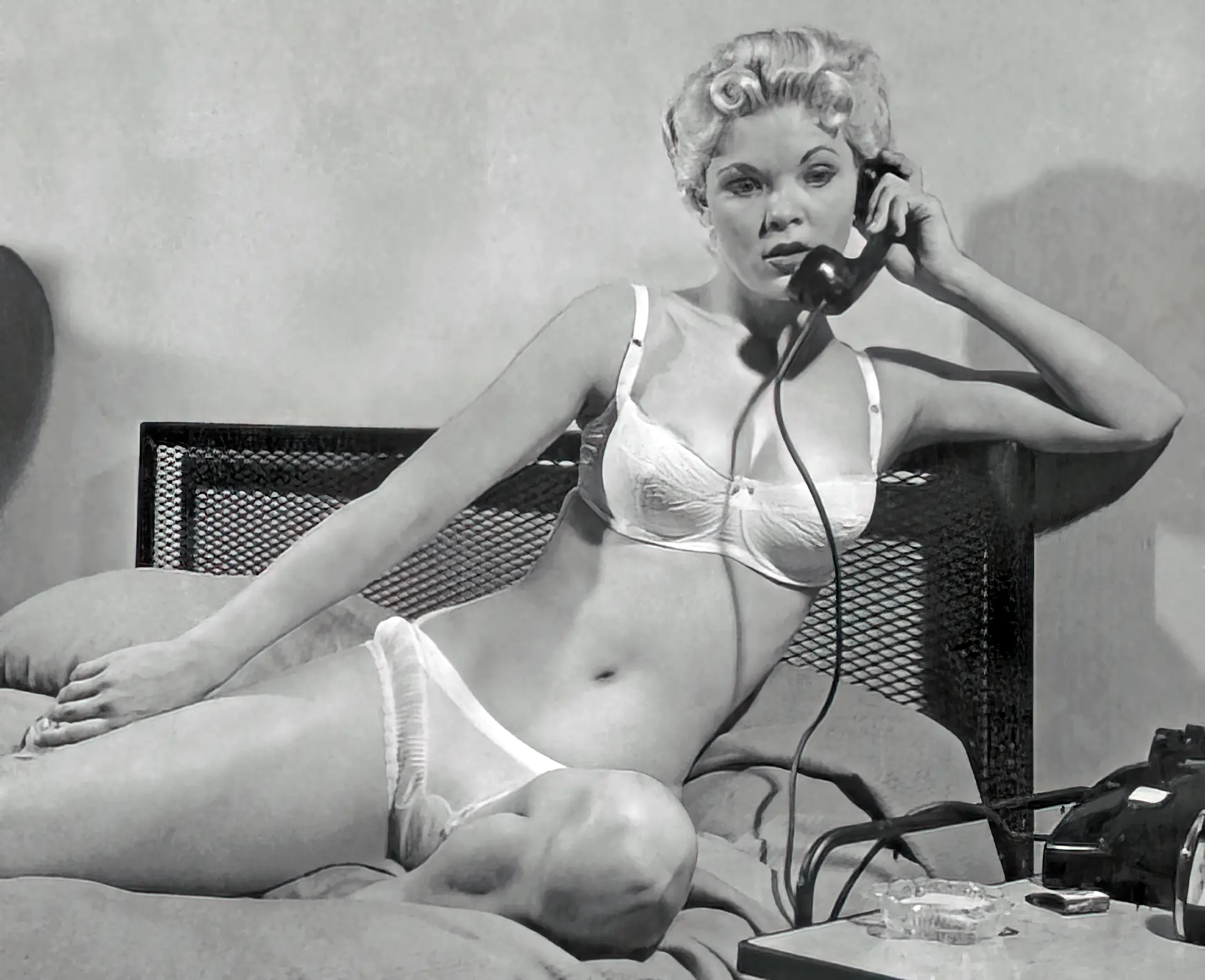 Dreamy Candy Barr talks on the phone in her white lingerie