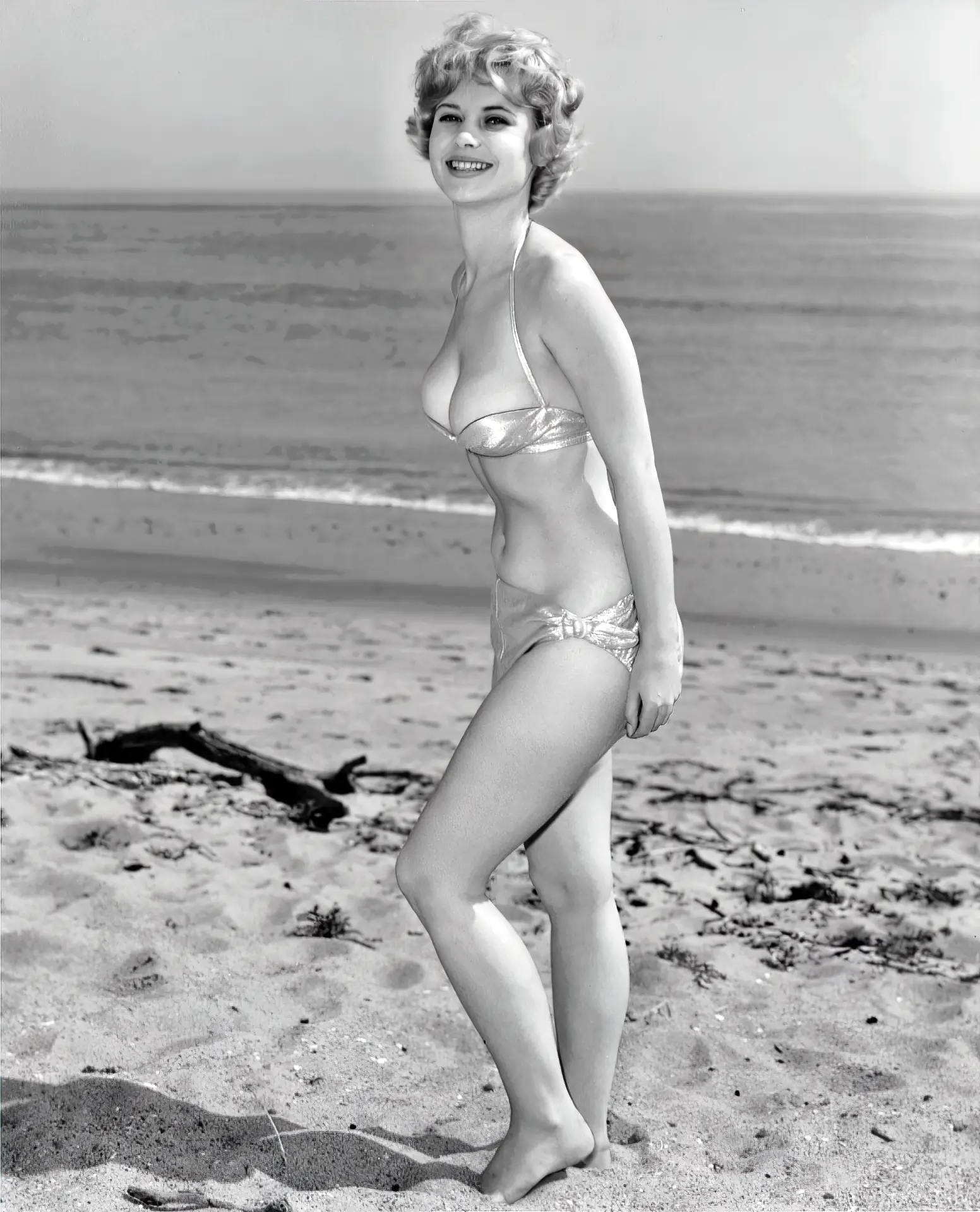 Flirty Gloria Dawn posing in her tiny bikini